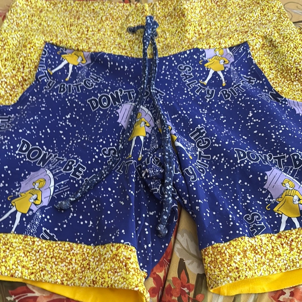 Blue and Yellow Athletic Shorts with Space-Themed Design